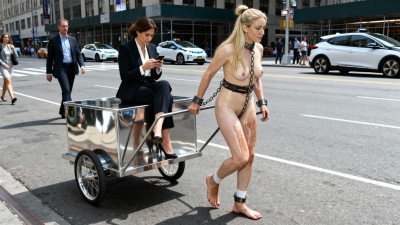 City PonyGirl Between Cars